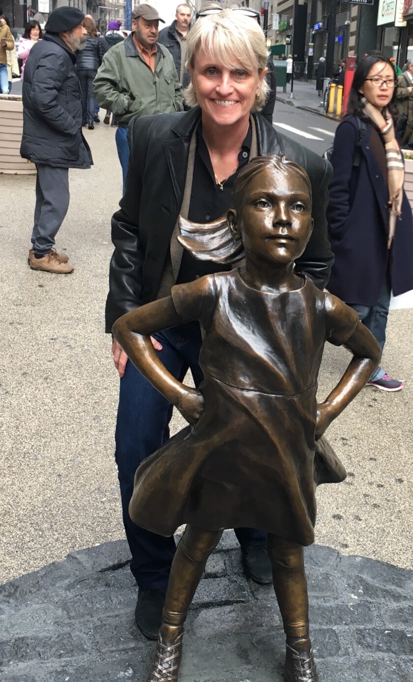 Adviser Carolyn McClanahan visited by A Brave Girl statue in New York