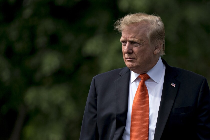 President Donald Trump arrives to speak to members of the media before boarding Marine One on the South Lawn of the White House.