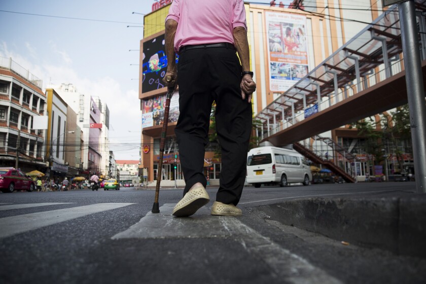 old man walking with cane.jpg