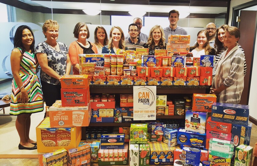 Smith Leonard staff with donated food