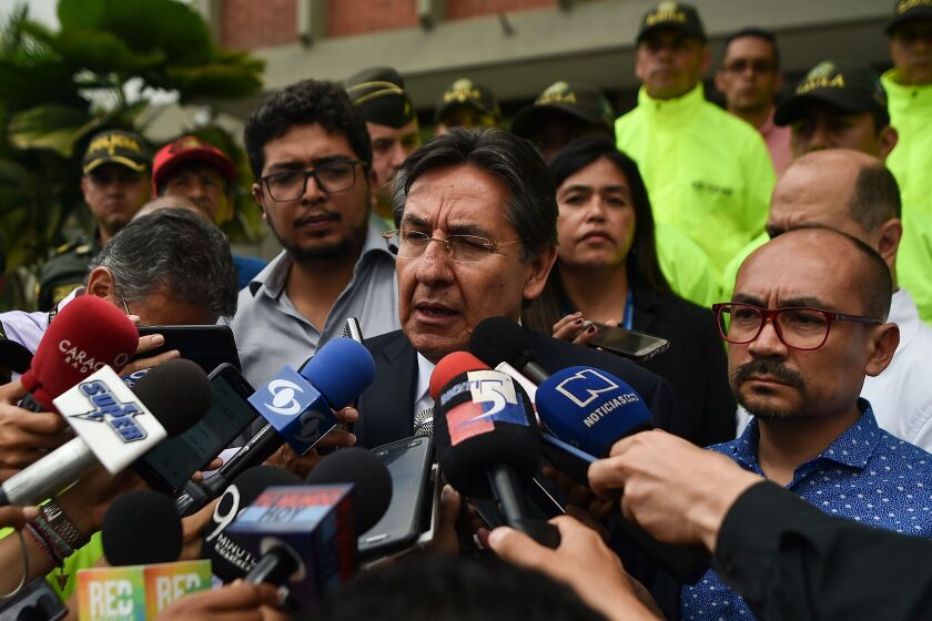 Colombian Attorney General Nestor Humberto Martinez speaks to the press after the identification of slain Ecuadorean El Comercio journalist Javier Ortega, photographer Paul Rivas, and driver Efrain Segarra.
