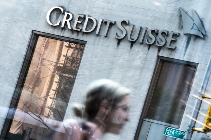 A pedestrian walks past the Credit Suisse Group AG headquarters in New York, U.S., on Wednesday, Sept. 19, 2018. Credit Suisse and UBS Group AG could manage a potential share sale of Stadler Rail AG as it explores a potential initial public offering. Photographer: Jeenah Moon/Bloomberg