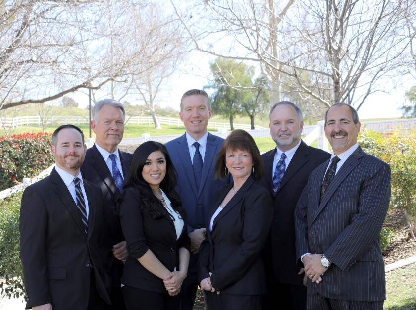 Stifel recently picked up a former Merrill Lynch team that oversaw nearly $600 million in client assets. From left to right: Ron Benoit, Greg Munro, Coni Resendiz, Robert Babcock, Peg Allen, Tony Ondracek and Gary Allen.