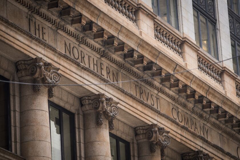 Signage is displayed on the exterior of a Northern Trust Corp. branch in Chicago, Illinois, U.S, on Thursday, July 13, 2017. Northern Trust Corp. is scheduled to release earnings figures on July 19. Photographer: Christopher Dilts/Bloomberg