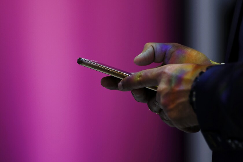 di-using-smartphone-stock-041619.jpg