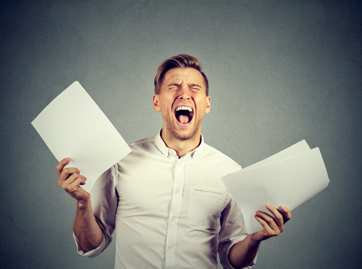 Angry man with forms