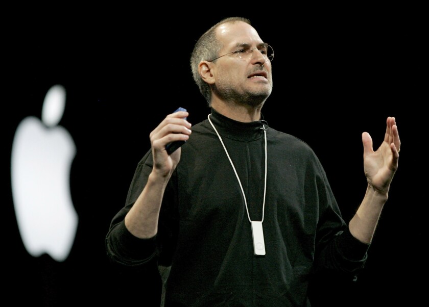 Steve Jobs, CEO of Apple Computer Inc., wears an iPod Shuffle around his neck during his keynote at Macworld in San Francisco on January 11, 2005.