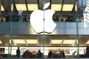 Customers shops in an Apple Inc. store in Sydney, Australia.