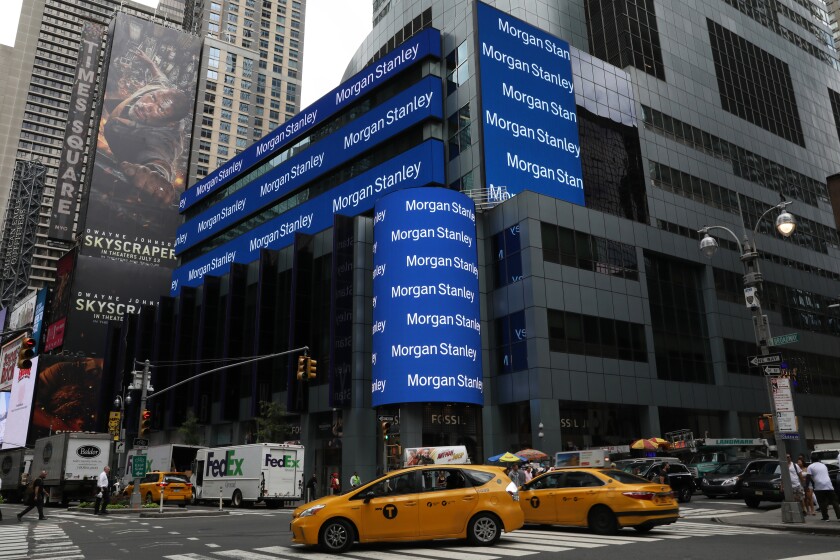 Taxi cabs pass in front of Morgan Stanley headquarters in New York, U.S., on Thursday, July 12, 2018. Morgan Stanley is scheduled to release earnings figures on July 18. Photographer: Bess Adler/Bloomberg
