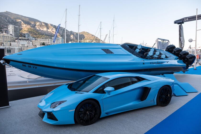A luxury Lamborghini El Toro speedboat and automobile, manufactured by Automobili Lamborghini SpA, stand on display in the toys and tenders area during the Monaco Yacht Show (MYS) in Port Hercules, Monaco, on Wednesday, Sept. 26, 2018. Over 125 of the world's most luxurious yachts will be displayed during the 28th MYS, which runs Sept. 26 - 29. Photographer: Balint Porneczi/Bloomberg