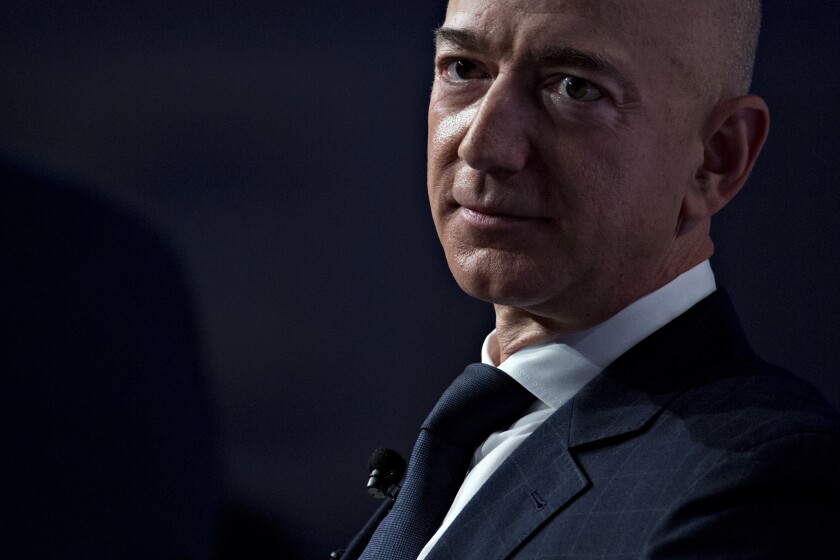 Jeff Bezos, founder and chief executive officer of Amazon.com Inc., listens during a discussion at the Air Force Association's Air, Space and Cyber Conference in National Harbor, Maryland, U.S., on Wednesday, Sept. 19, 2018. Amazon is considering a plan to open as many as 3,000 new AmazonGo cashierless stores in the next few years, according to people familiar with matter, an aggressive and costly expansion that would threaten convenience chains. Photographer: Andrew Harrer/Bloomberg