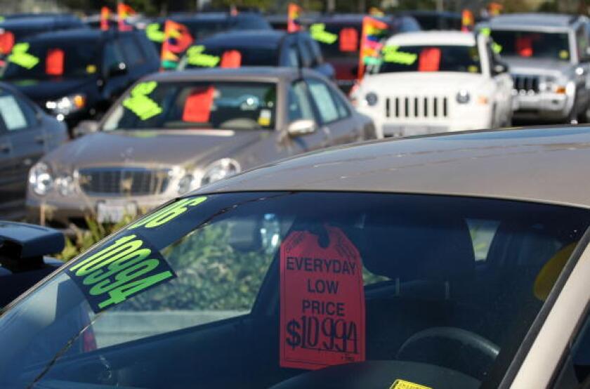 A car for sale at a Chrysler dealership.