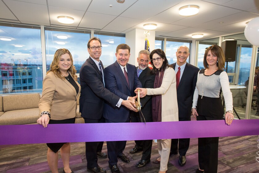 (L to R) Arlington Chamber of Commerce President and CEO Kate Bates, Arlington County Board Chair Jay Fisette, Grant Thornton CEO Mike McGuire, Grant Thornton Public Sector National Managing Partner Carlos Otal, Grant Thornton Tax Services National Managing Partner Jamie Fowler, Arlington Economic Development Director Victor Hoskins, and Rosslyn Business Improvement District President Mary-Claire Burick pose at the grand opening of Grant Thornton LLP’s new Metro DC office on Feb. 9, 2017.