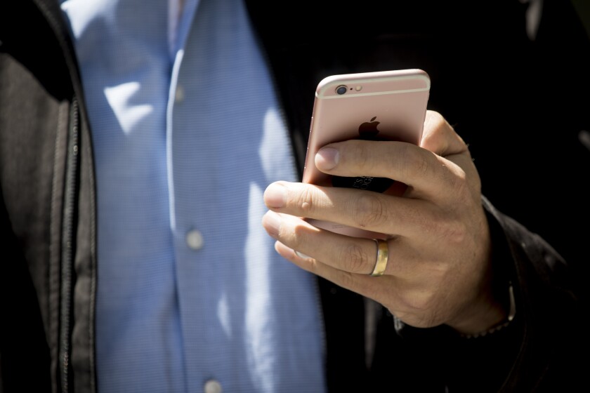 di-using-phone-stock-082418.jpg