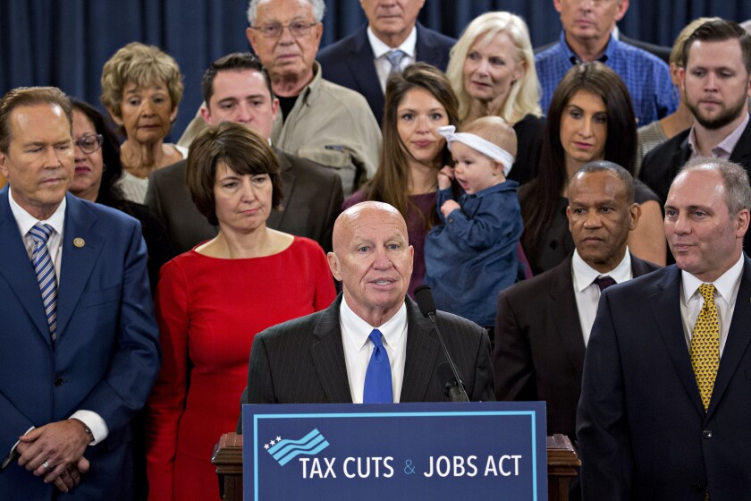 Representative Kevin Brady, a Republican from Texas and chairman of the House Ways and Means Committee, center, speaks as House Majority Whip Steve Scalise, a Republican from Louisiana, right, listens during a news conference on tax reform in Washington, D.C., U.S., on Thursday, Nov. 2, 2017.