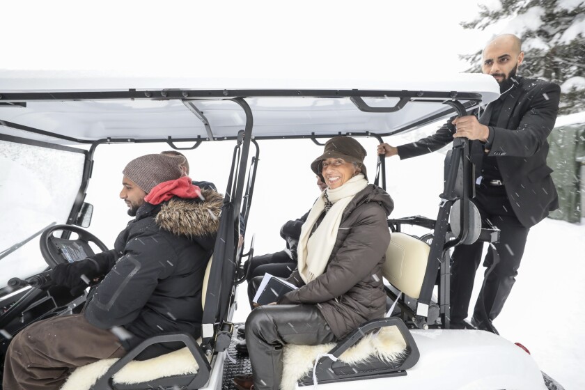 Christine Lagarde, managing director of the International Monetary Fund, uses an electric cart to move between venues ahead of the World Economic Forum in Davos, Switzerland.