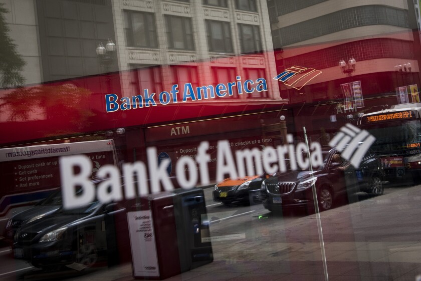 Vehicles are reflected in the window of a Bank of America branch in Chicago, July 9, 2017 Bloomberg News