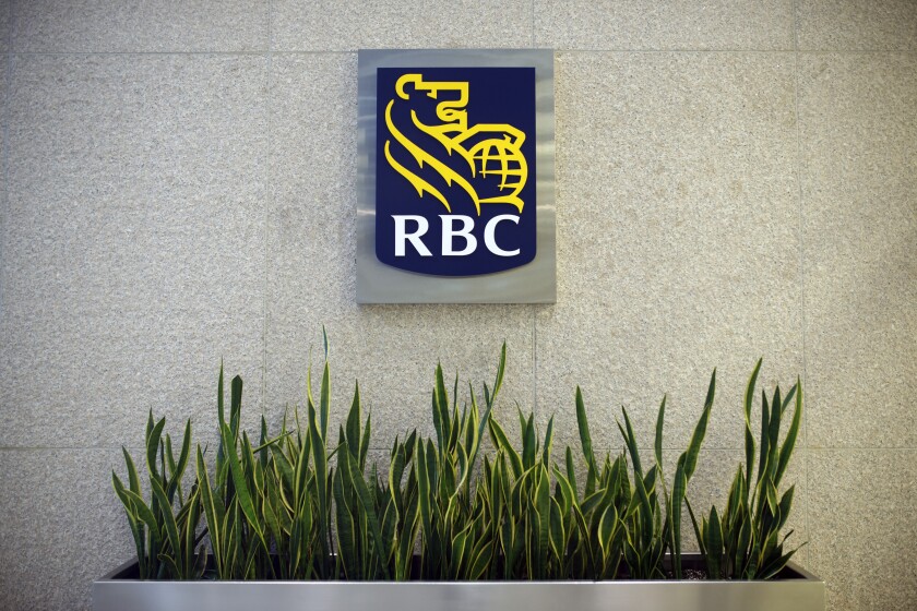 Logo with grasss of Royal Bank of Canada (RBC) headquarters building during the company's annual general meeting in Toronto, Ontario, Canada, on Thursday, April 6, 2017