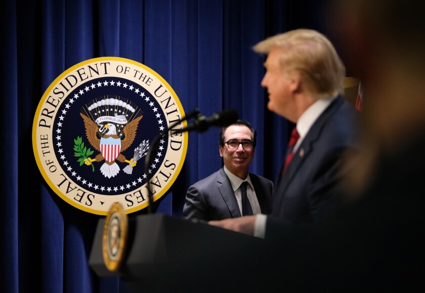 Treasury Secretary Steven Mnuchin watches President Donald Trump