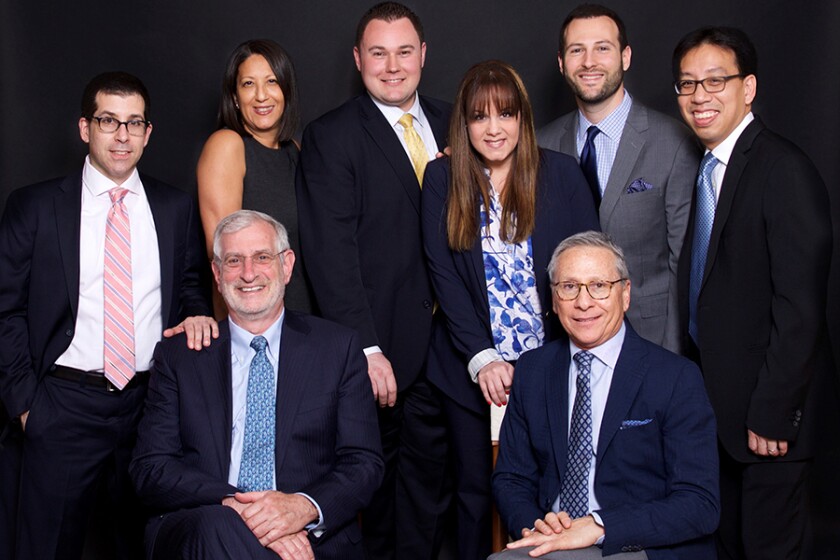 After more than a decade with Wells Fargo, a nine-member team moved its practice to Raymond James for its corporate culture and platform. Left to right: (Seated) Stephen Adler, Mark Levy, (Standing) Michael Lubin, Allison Guzman, Christopher Swanson, Loriann Montanez, Stephen Orzo, Roger Jee