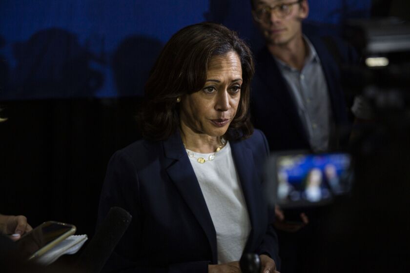 Senator Kamala Harris, a Democrat from California and 2020 presidential candidate, listens to a question from a reporter during a town hall event in Somersworth, New Hampshire.