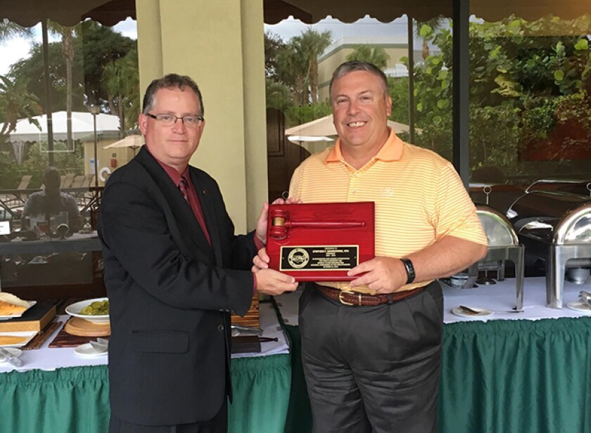 New NCCPAP president Neil Fishman (left) honoring immediate past president Stephen Mankowski