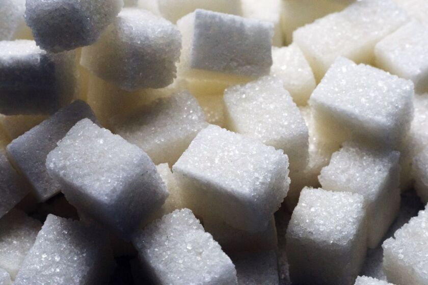 Piles of refined white sugar cubes sit at the ED&F Man Ltd. refinery in Nikolaev, Ukraine