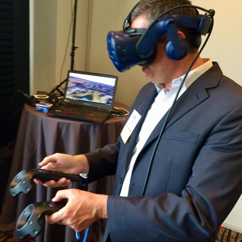 Bill Martin, chief investment officer at Wichita, Kansas-based INTRUST Bank, tries out VR goggles at Fidelity Investments’ client advisory council meeting in Boston.