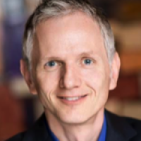 Chuck Densinger Headshot 2.png
