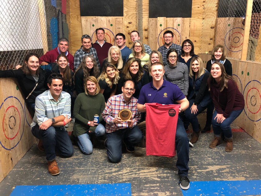 Staff from GMS Surgent at an axe-throwing event