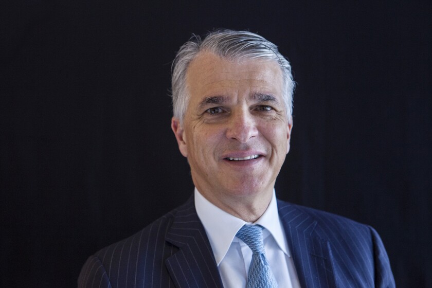 Sergio Ermotti, chief executive officer of UBS Group AG, poses for a photograph following a Bloomberg Television interview on the sidelines of the China Development Forum in Beijing, China, on Saturday, March 24, 2018. UBS is considering small acquisitions to complement its focus on organic growth as it reverses a shrinking of assets following the financial crisis. Photographer: Giulia Marchi/Bloomberg