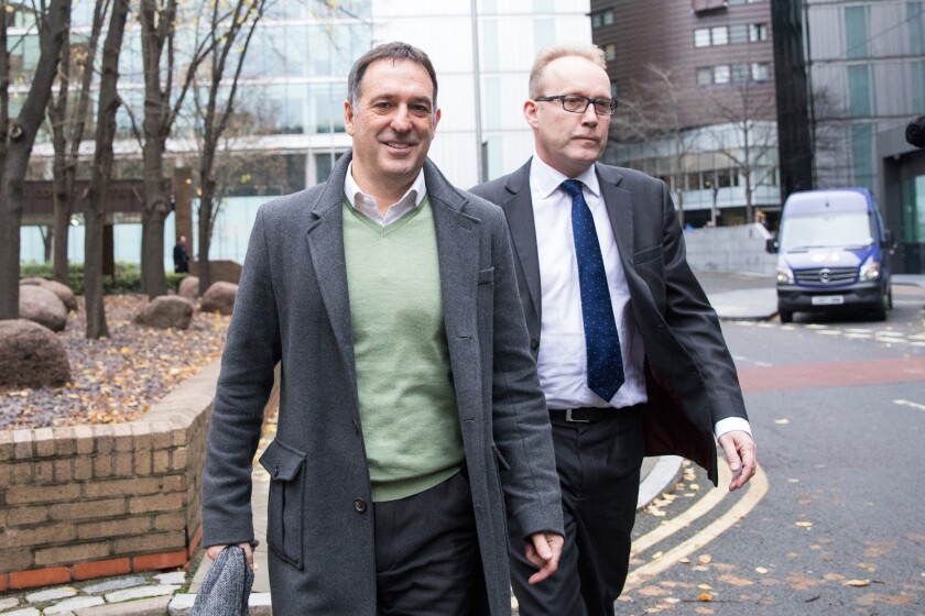 Chris Bush, former U.K. managing director for Tesco Plc, departs Southwark Crown Court following the dismissal of their accounting-scandal Case in London.