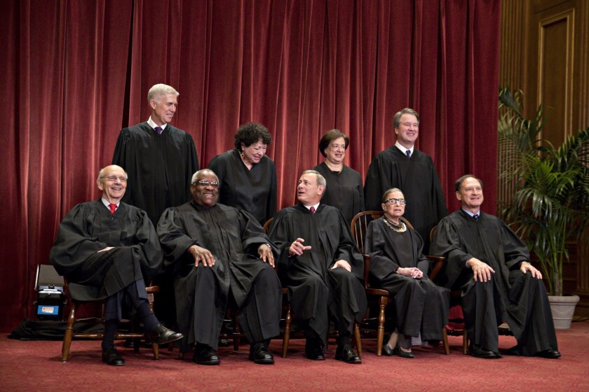 Justices of the U.S. Supreme Court pose during their formal group photograph in the East Conference Room of the Supreme Court in Washington, D.C., U.S. Seated from left: Associate Justice Stephen Breyer, Associate Justice Clarence Thomas, Chief Justice John Roberts, Associate Justice Ruth Bader Ginsburg and Associate Justice Samuel Alito Jr. Standing behind from left: Associate Justice Neil Gorsuch, Associate Justice Sonia Sotomayor, Associate Justice Elena Kagan and Associate Justice Brett Kavanaugh.