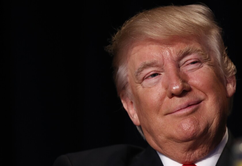President Trump smirking Bloomberg news photo