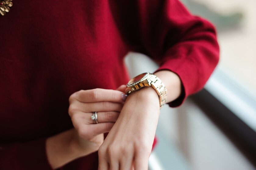woman checking wristwatch