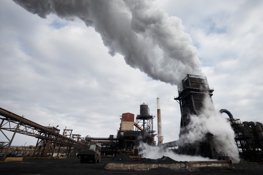 Steam rises from a coke quenching tower at the Stelco Holdings Inc. plant in Nanticoke, Ontario, Canada.