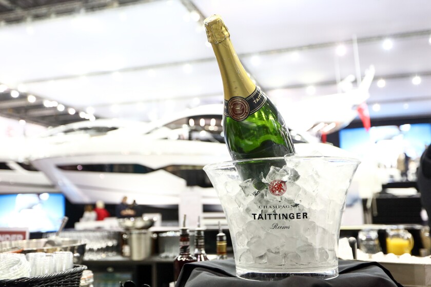 A bottle of Taittinger champagne sits in a bucket of ice at the London Boat Show in London, U.K., on Friday, Jan. 6, 2017. Boats are getting greener, lightweight materials such as composites and glass make for sleeker designs and more efficient fuel consumption, Boat International magazine Chief Executive Officer Tony Harris said during an interview. Photographer: Chris Ratcliffe/Bloomberg