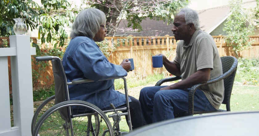 elderly couple old couple wheelchair coffee diverse couple diversity Dec. 14 Adobe Stock