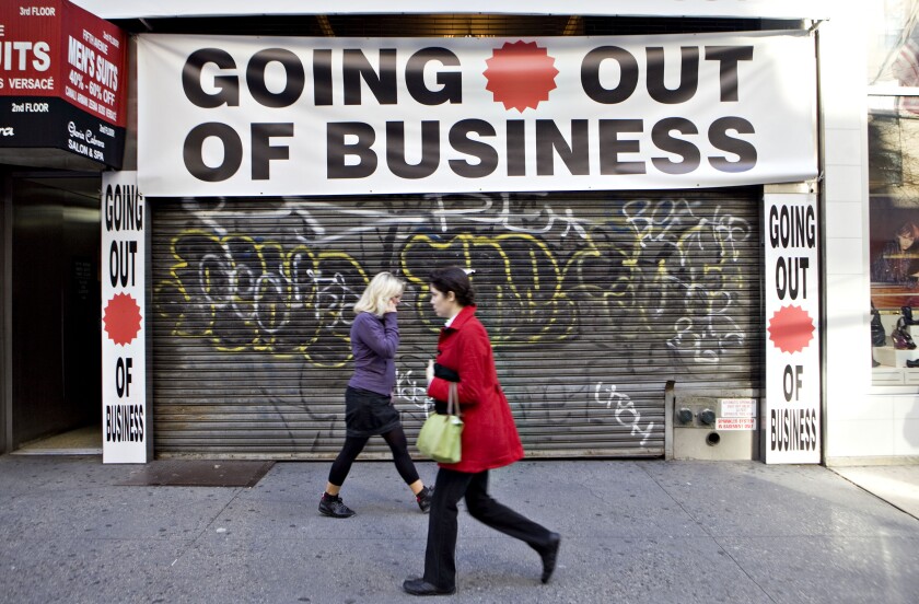 A storefront with a 'Going out of business' sign