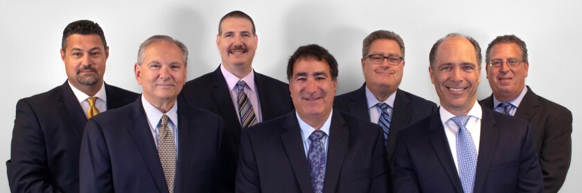 Front row (left to right): Anthony J. Viola, Randy Sofferman and Kenneth Lipner. Back row: Robert J. Mauro, Michael D. Katz, Eliot H. Lebenhart and Jay Lipner.