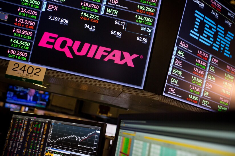 A monitor displays Equifax signage on the floor of the New York Stock Exchange.