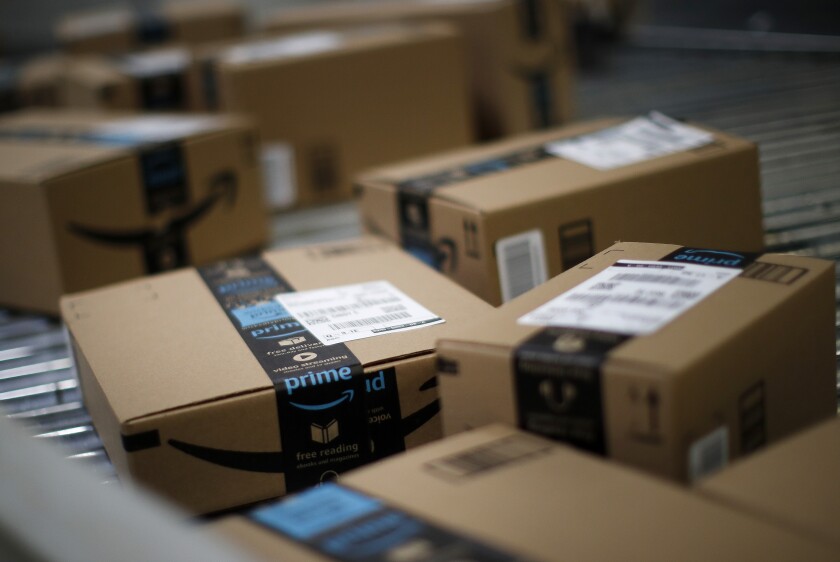 Boxes move along a conveyor belt at the Amazon.com fulfillment center in Kenosha, Wisconsin, on Tuesday, Aug. 1, 2017.